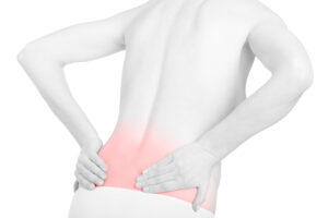 Woman experiencing lower back pain before treatment in Painesville, OH
